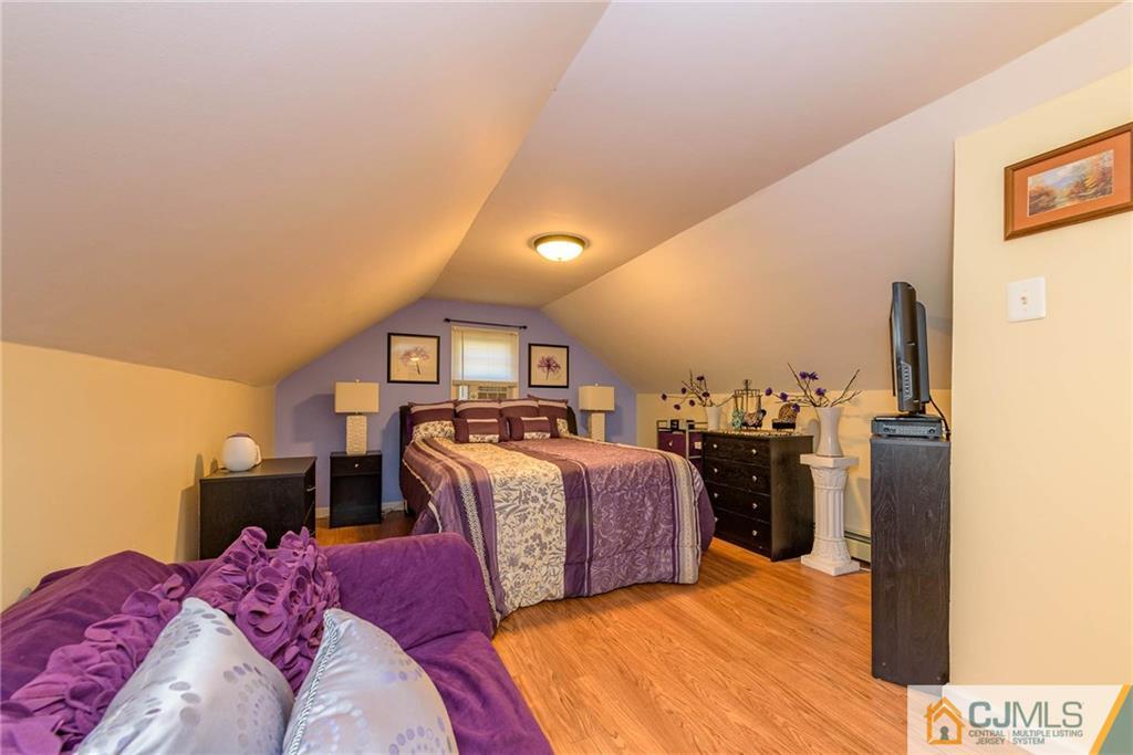68 Sturgis Road Edison, NJ 08817 - Photo 16 of 25 a bed room with a bed and a television