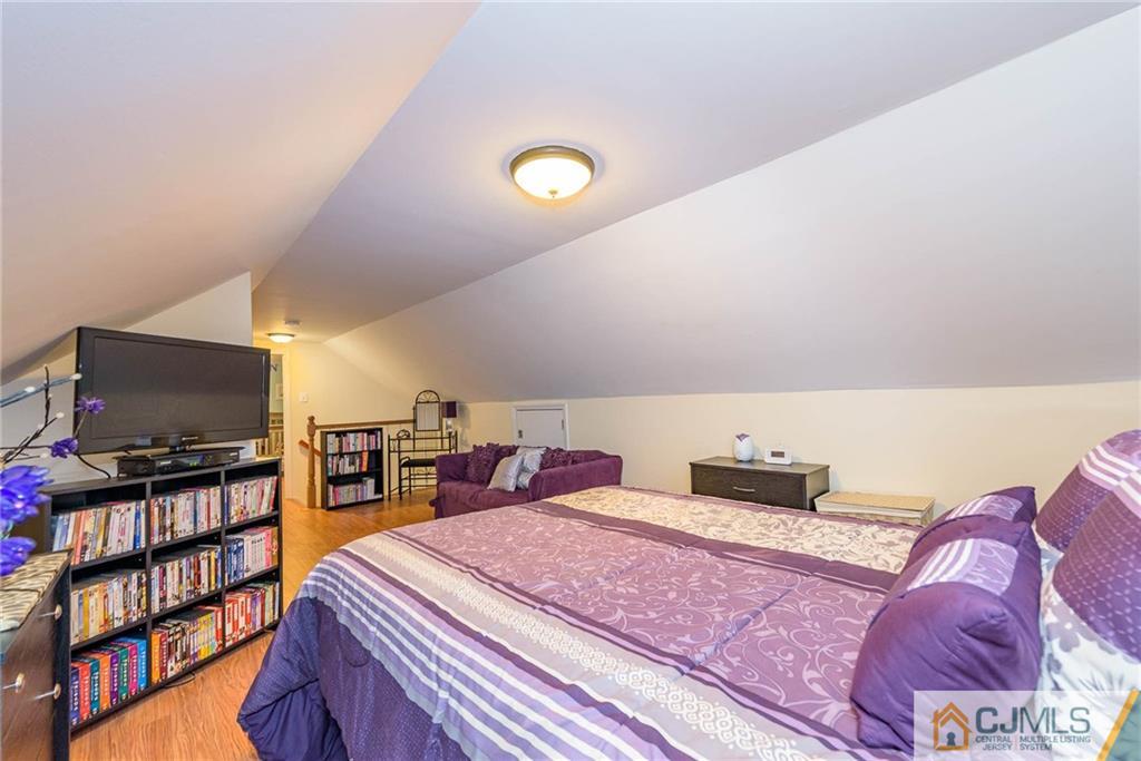 68 Sturgis Road Edison, NJ 08817 - Photo 17 of 25 a bedroom with a bed and a flat screen tv