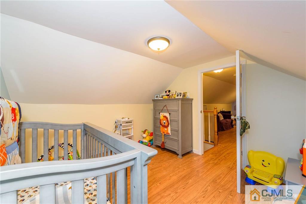 68 Sturgis Road Edison, NJ 08817 - Photo 20 of 25 a view of a hallway with a yellow slide