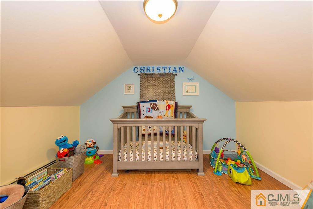 68 Sturgis Road Edison, NJ 08817 - Photo 21 of 25 a room with toys and a wooden floor