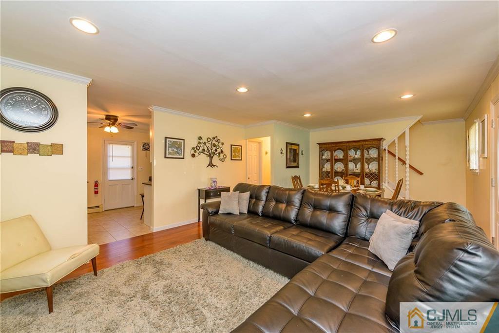 68 Sturgis Road Edison, NJ 08817 - Photo 6 of 25 a living room with furniture and a rug