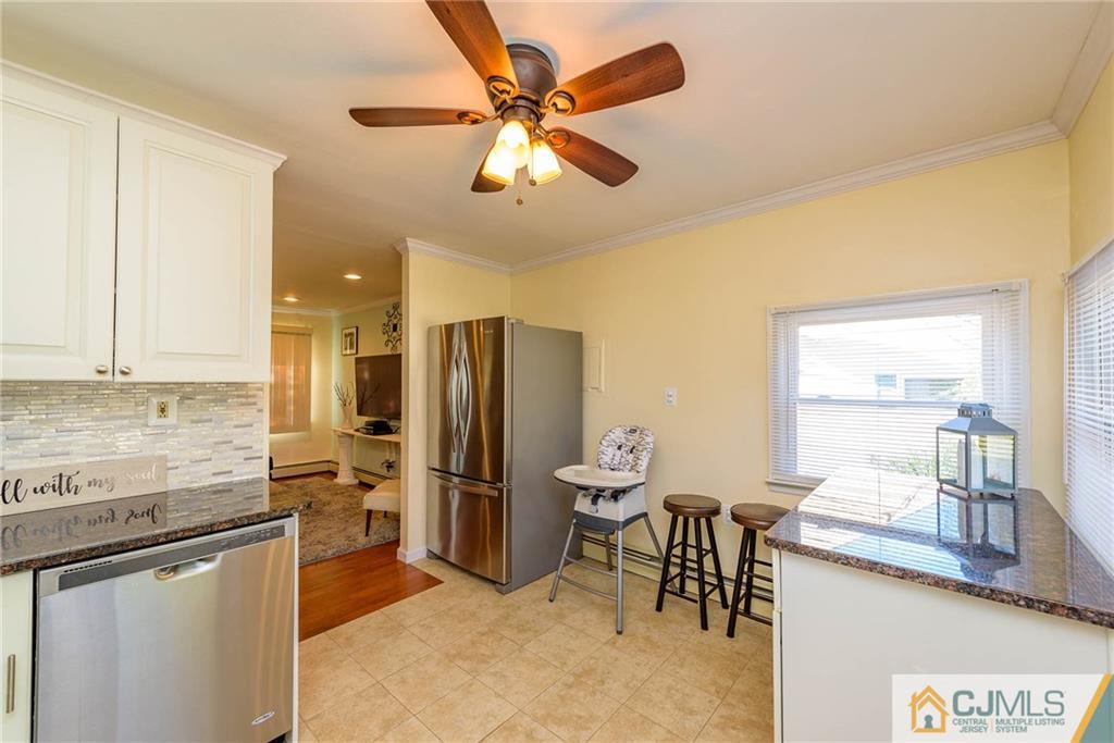 68 Sturgis Road Edison, NJ 08817 - Photo 9 of 25 a kitchen with a refrigerator and a sink