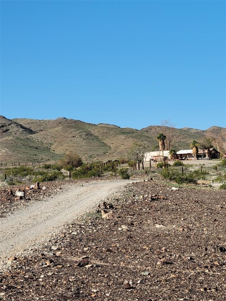 65922167 Unincorporated Parcel Needles, CA 92363 - Photo 1 of 47 a view of a dry yard with green space