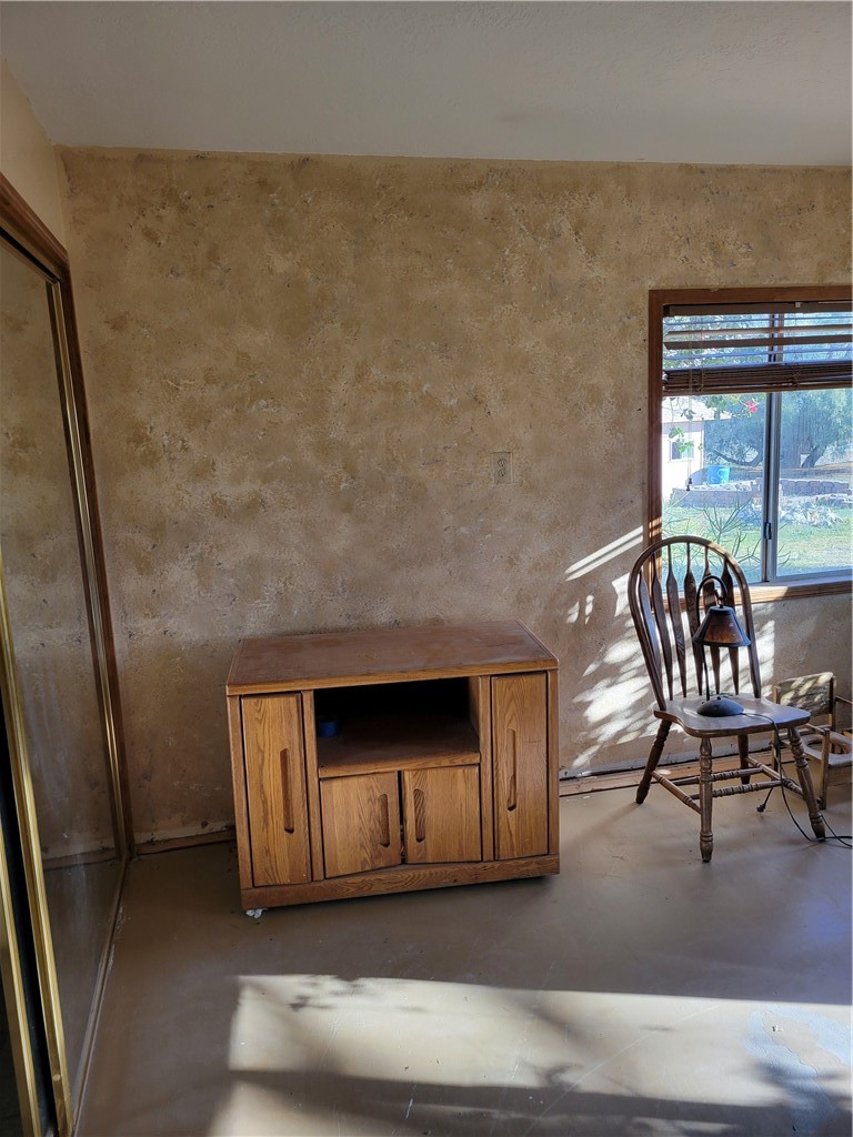 65922167 Unincorporated Parcel Needles, CA 92363 - Photo 24 of 47 a living room with furniture and a fireplace