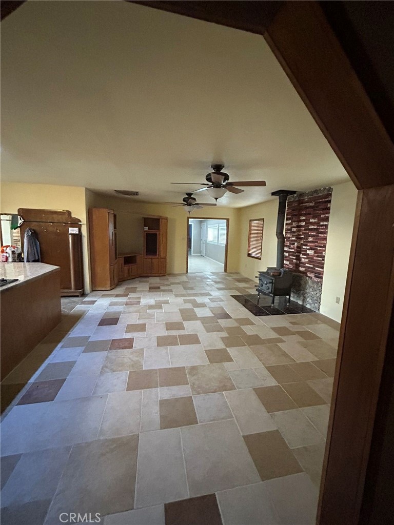 65922167 Unincorporated Parcel Needles, CA 92363 - Photo 25 of 47 a view of a hallway with a kitchen