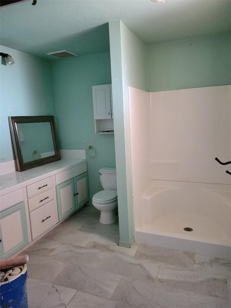 65922167 Unincorporated Parcel Needles, CA 92363 - Photo 30 of 47 a bathroom with a toilet sink and mirror