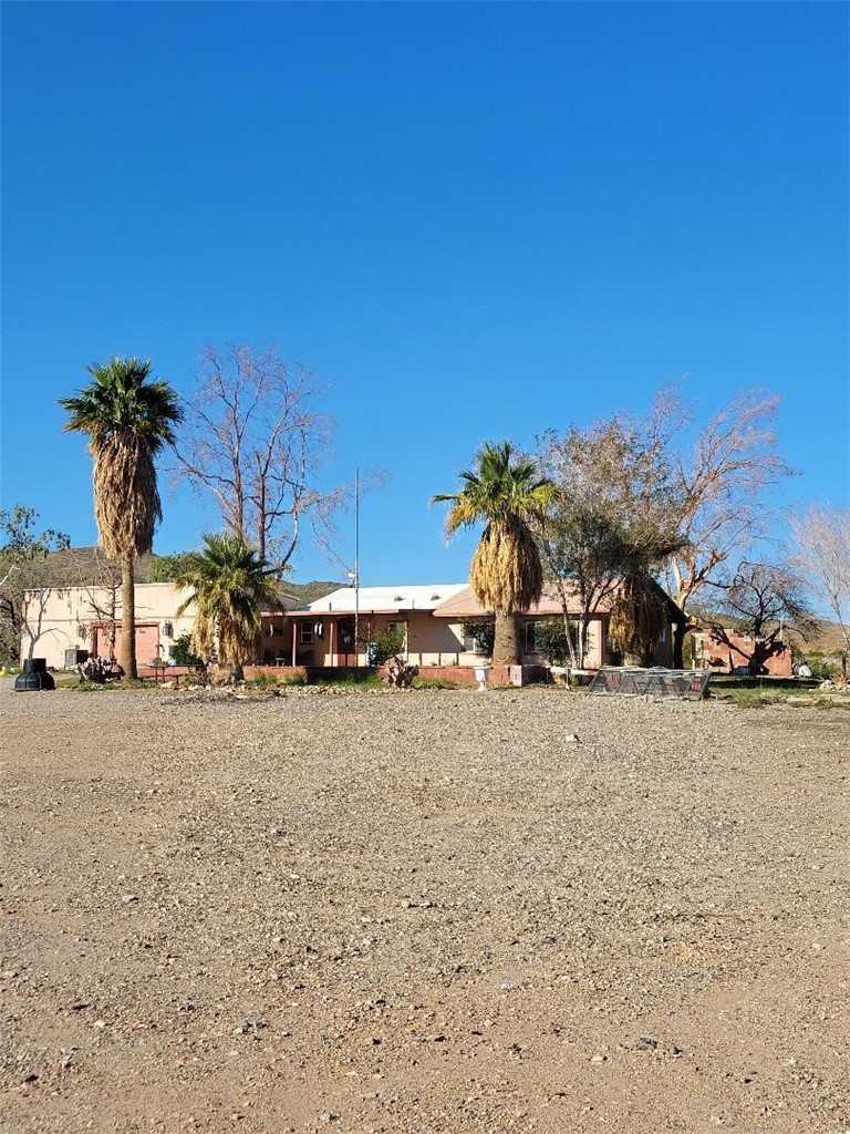 65922167 Unincorporated Parcel Needles, CA 92363 - Photo 3 of 47 a view of a house with a yard