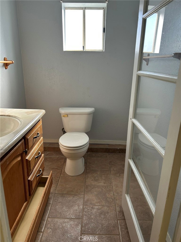 65922167 Unincorporated Parcel Needles, CA 92363 - Photo 34 of 47 a bathroom with a toilet and a sink