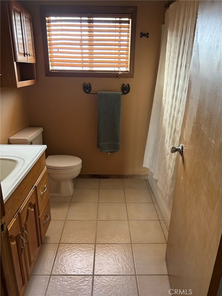 65922167 Unincorporated Parcel Needles, CA 92363 - Photo 35 of 47 a bathroom with a sink a toilet and a window