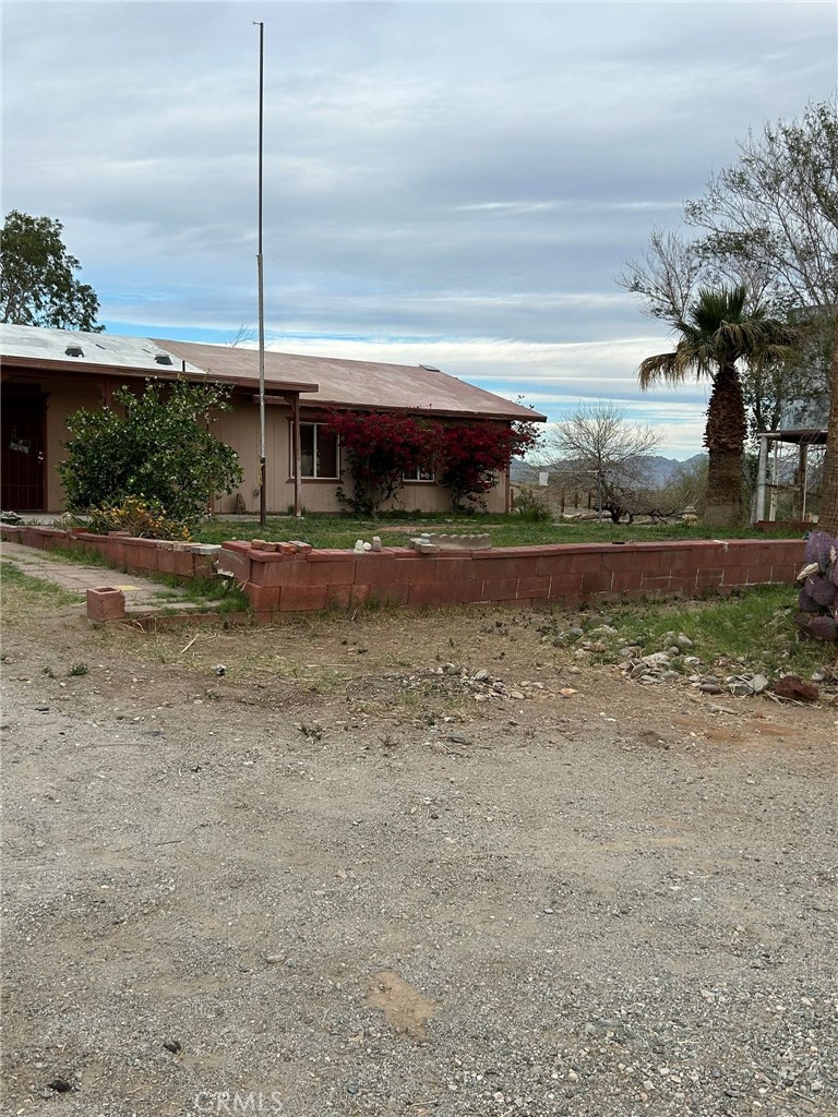 65922167 Unincorporated Parcel Needles, CA 92363 - Photo 7 of 47 a front view of house with yard