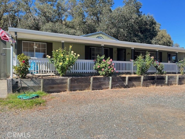 a front view of house with patio and garden