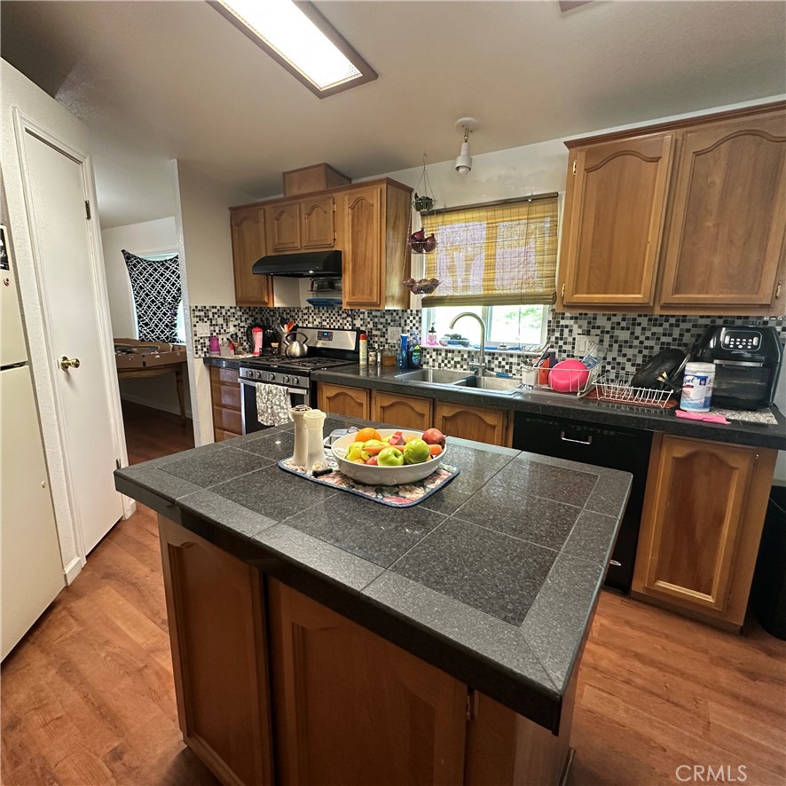 1335 Mountview Road Lakeport, CA 95453 - Photo 11 of 54 a kitchen with a sink refrigerator and cabinets