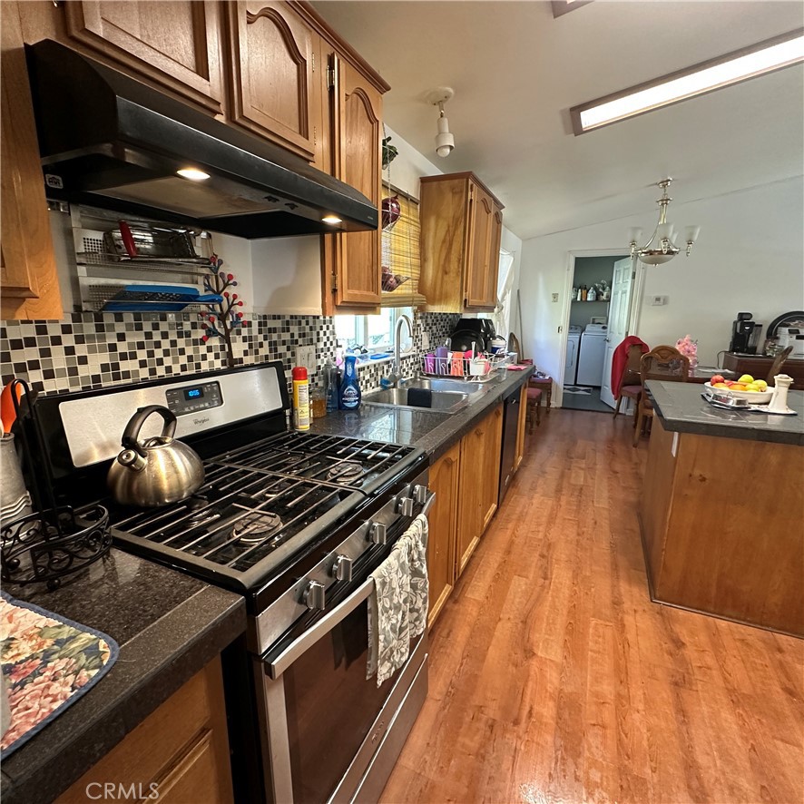 1335 Mountview Road Lakeport, CA 95453 - Photo 16 of 54 a kitchen with a stove and a wooden floor
