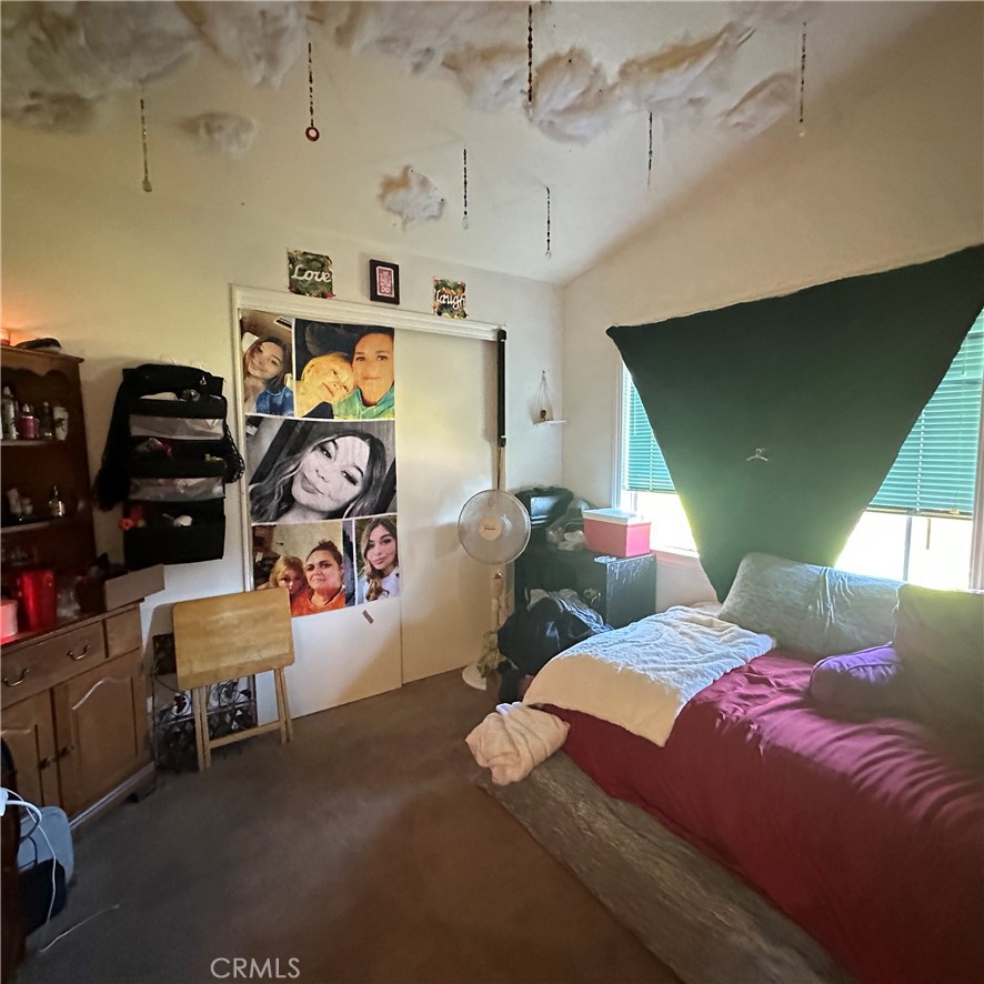 1335 Mountview Road Lakeport, CA 95453 - Photo 20 of 54 a bedroom with bed and a window