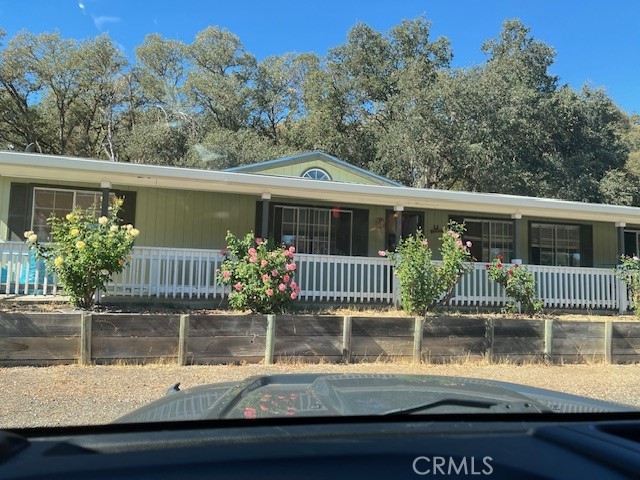 1335 Mountview Road Lakeport, CA 95453 - Photo 2 of 54 a front view of house with yard glass windows and palm tree