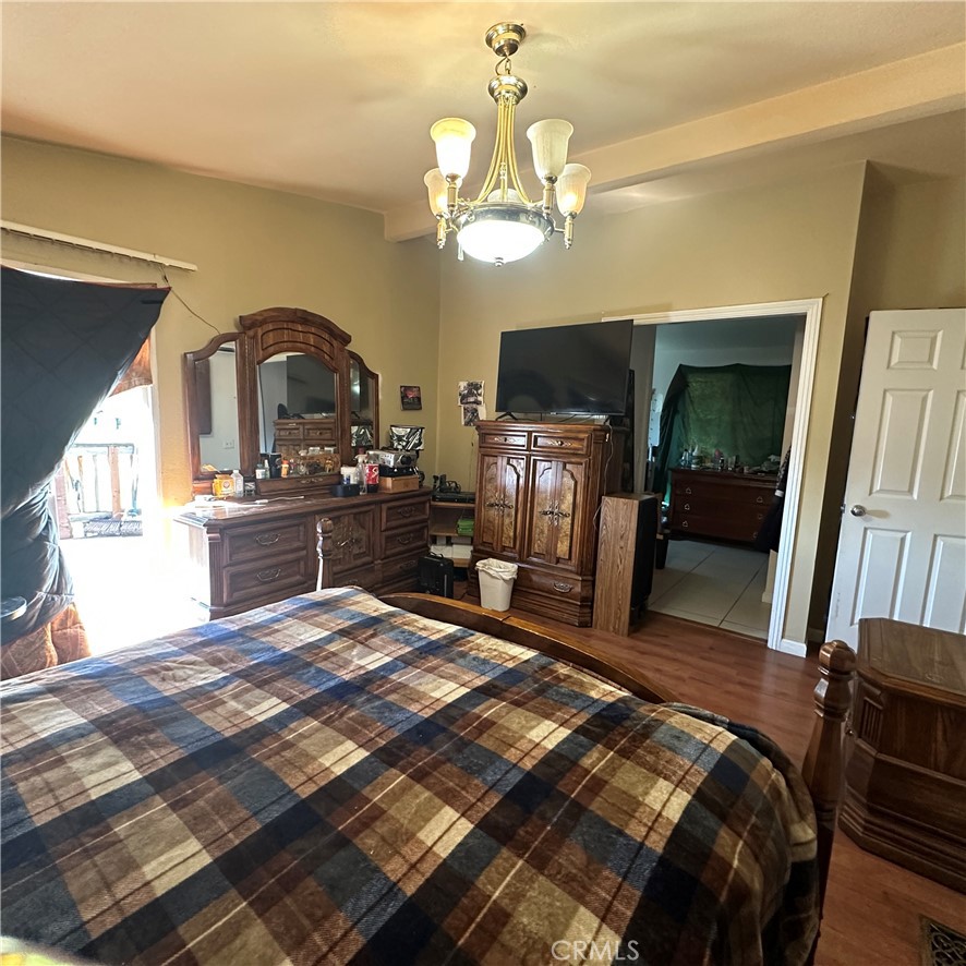 1335 Mountview Road Lakeport, CA 95453 - Photo 22 of 54 a bedroom with a bed and a flat tv screen on dresser