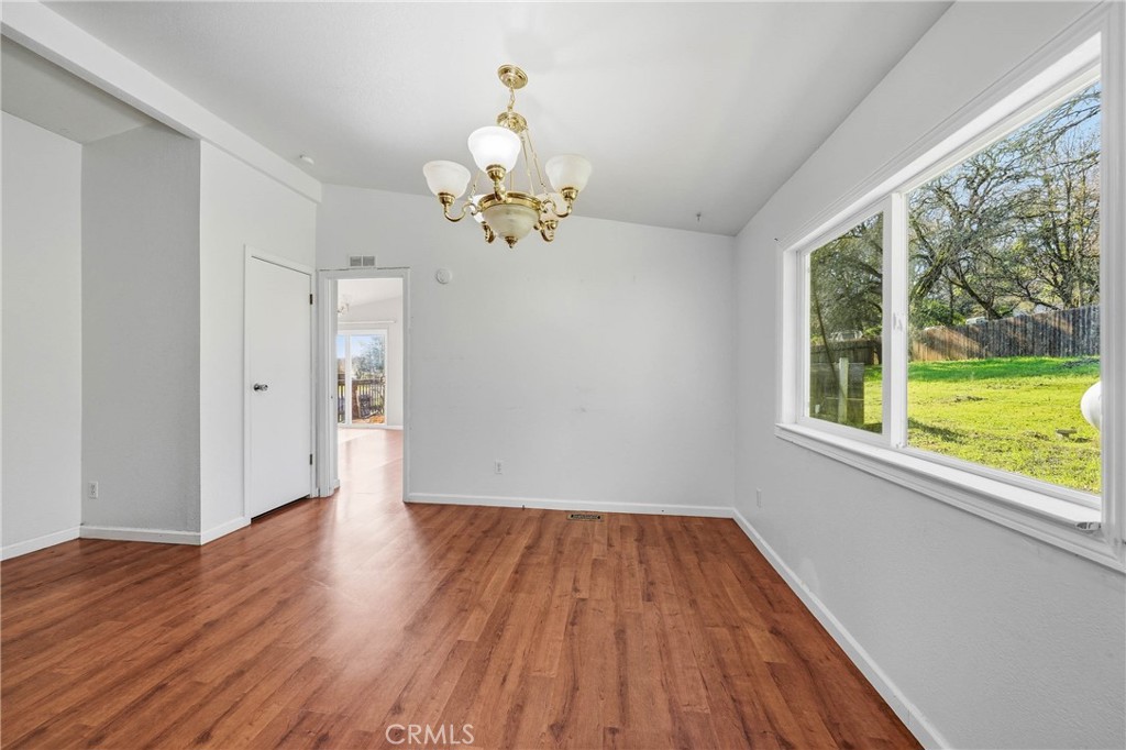 1335 Mountview Road Lakeport, CA 95453 - Photo 24 of 71 a view of an empty room with wooden floor and a window
