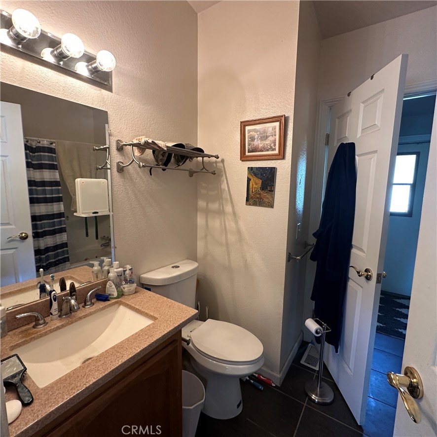 1335 Mountview Road Lakeport, CA 95453 - Photo 25 of 54 a bathroom with a sink mirror vanity and toilet