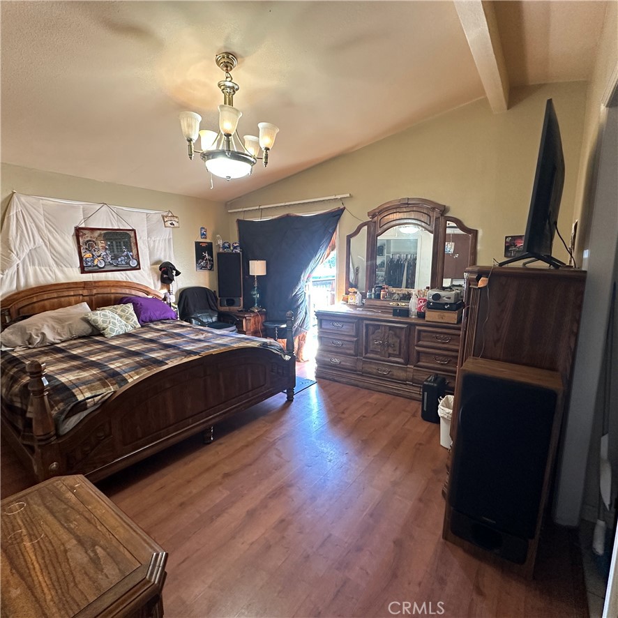 1335 Mountview Road Lakeport, CA 95453 - Photo 27 of 54 a bedroom with a bed and wooden floor