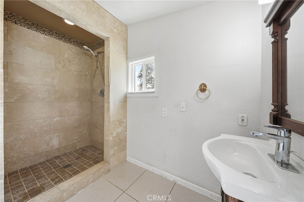 1335 Mountview Road Lakeport, CA 95453 - Photo 33 of 71 a bathroom with a sink a shower and a mirror