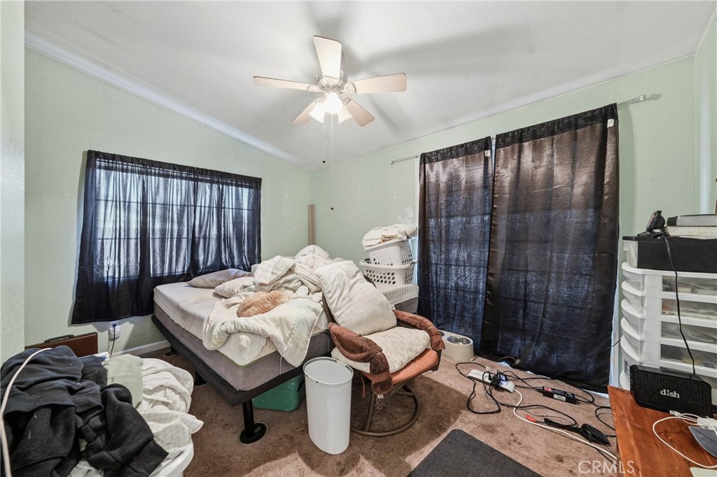 1335 Mountview Road Lakeport, CA 95453 - Photo 40 of 71 a bedroom with a bed and a chandelier
