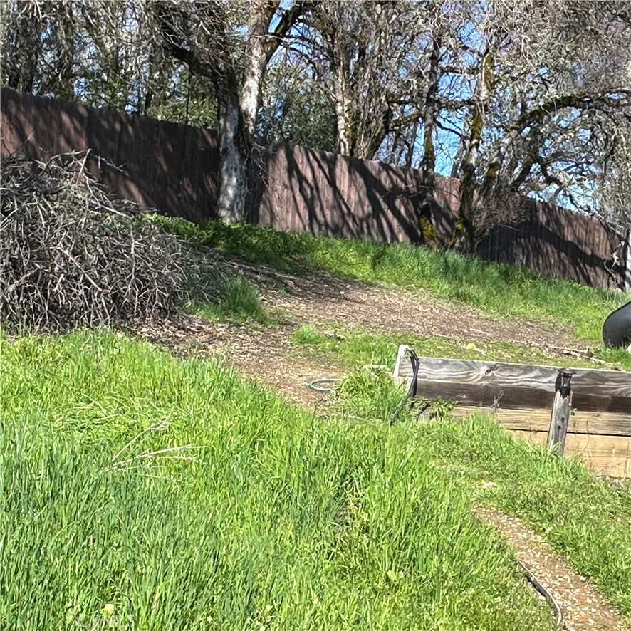 1335 Mountview Road Lakeport, CA 95453 - Photo 45 of 54 a view of backyard with table and chairs and wooden fence