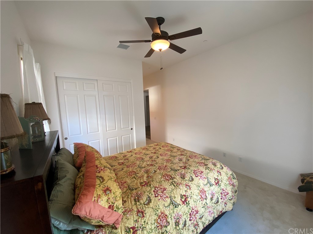 1563 Savannah Creek Beaumont, CA 92223 - Photo 15 of 28 a bed room with a bed and a chair