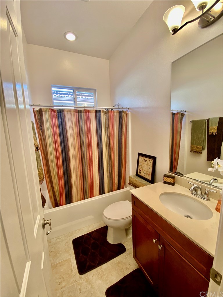 1563 Savannah Creek Beaumont, CA 92223 - Photo 16 of 28 a bathroom with a sink a toilet and shower