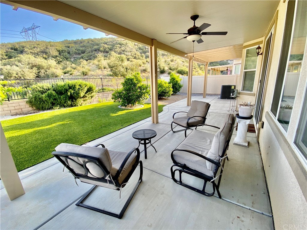 1563 Savannah Creek Beaumont, CA 92223 - Photo 23 of 28 a view of a patio with chairs and a table