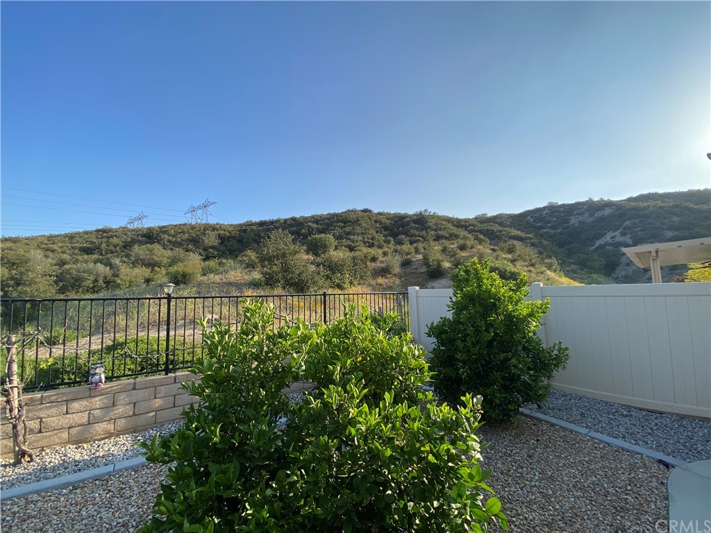 1563 Savannah Creek Beaumont, CA 92223 - Photo 26 of 28 a view of a lake with a mountain in the background