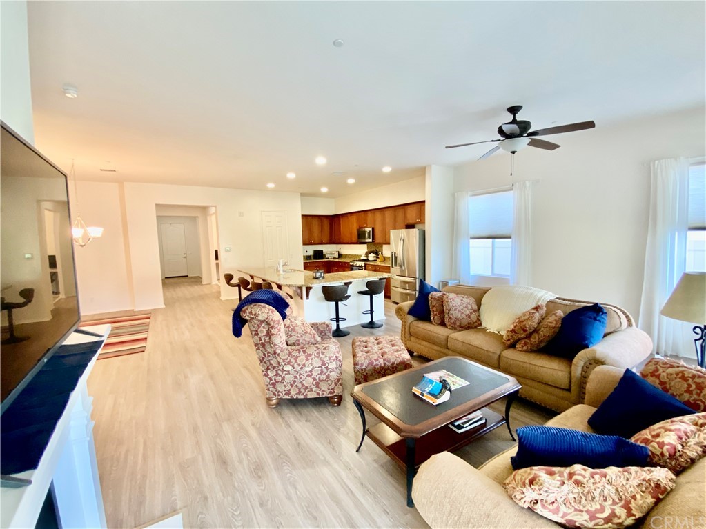 1563 Savannah Creek Beaumont, CA 92223 - Photo 9 of 28 a living room with furniture and a flat screen tv