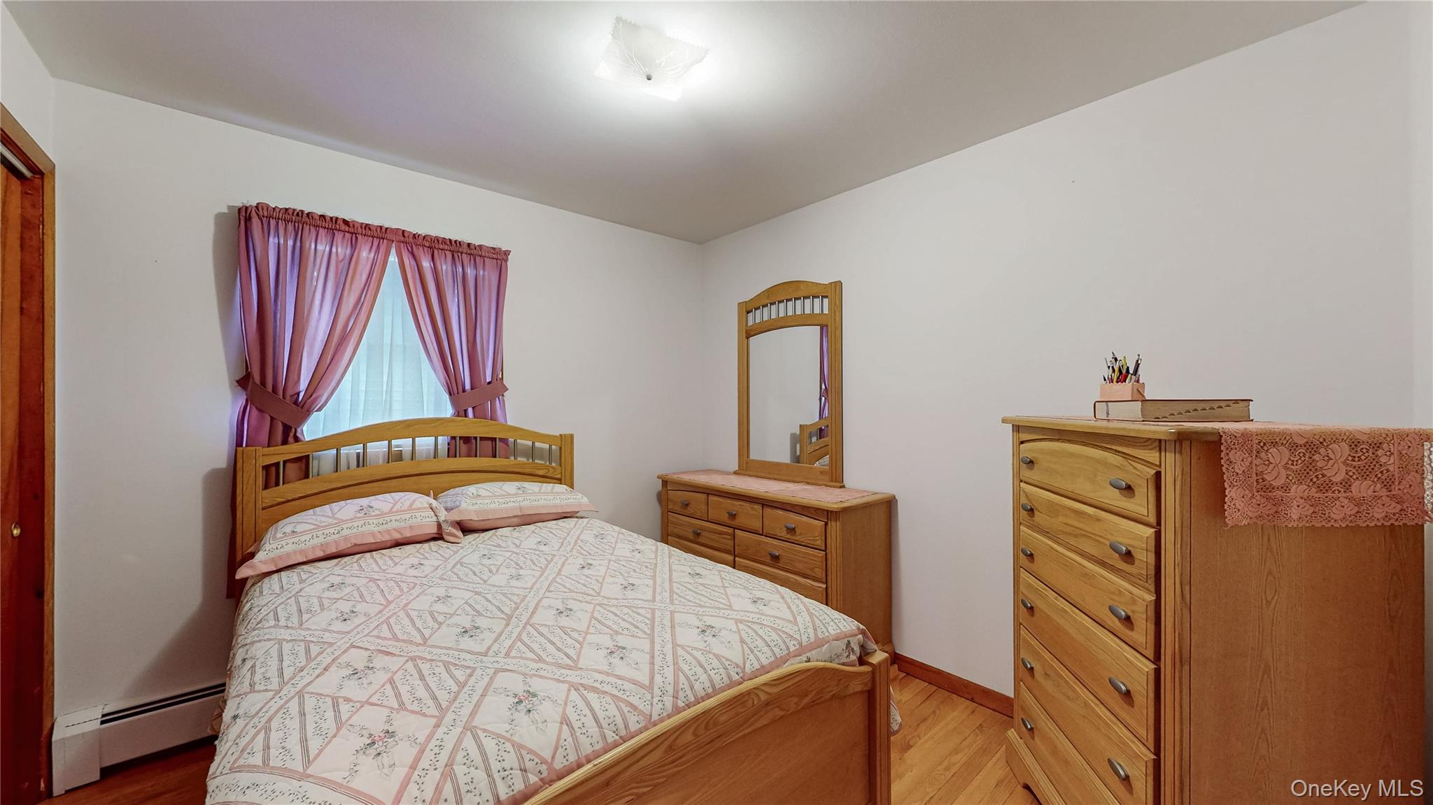 31 Rose Street Florida, NY 10921 - Photo 12 of 31 a bedroom with a bed and dresser