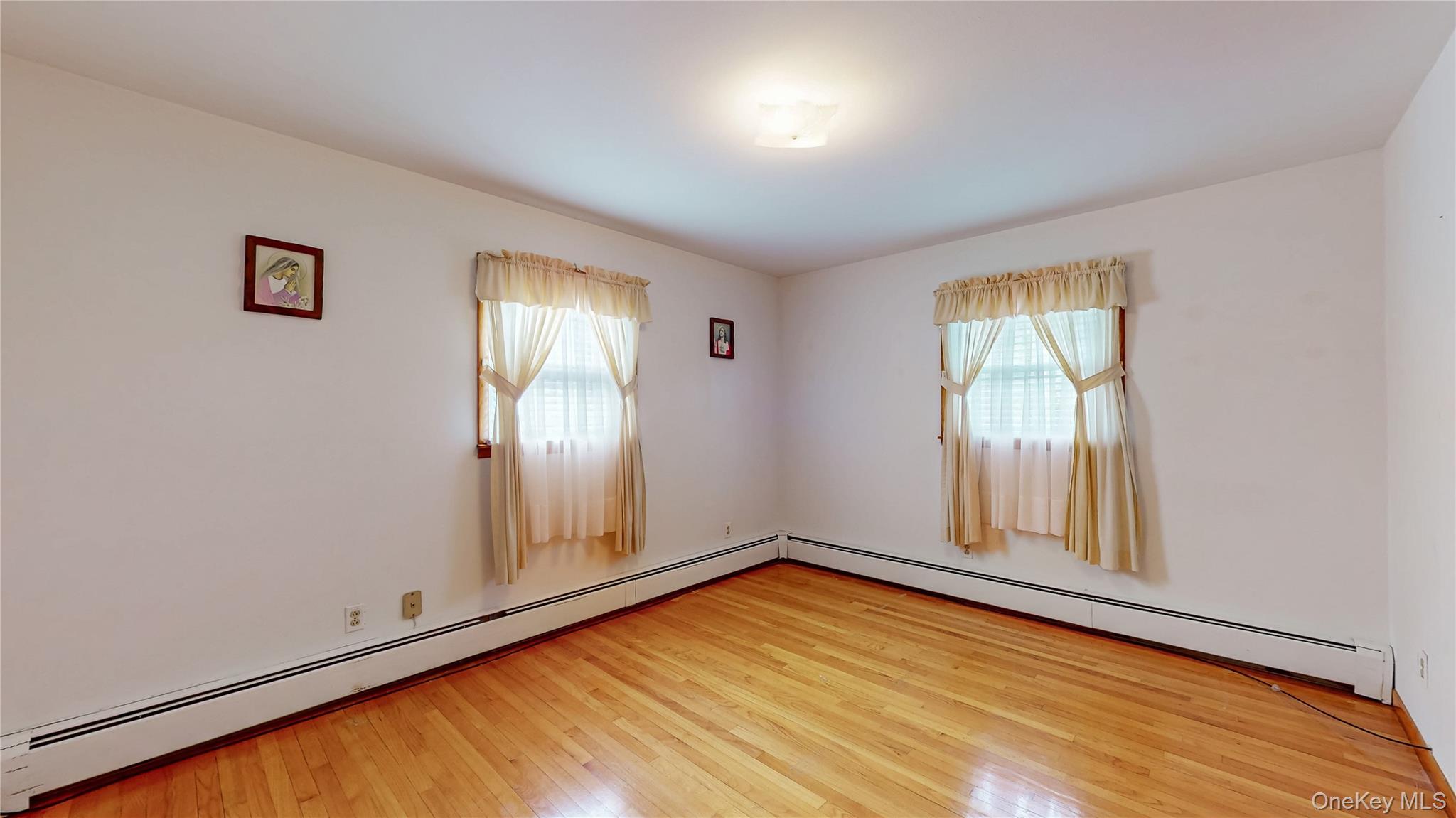 31 Rose Street Florida, NY 10921 - Photo 16 of 31 an empty room with wooden floor and windows