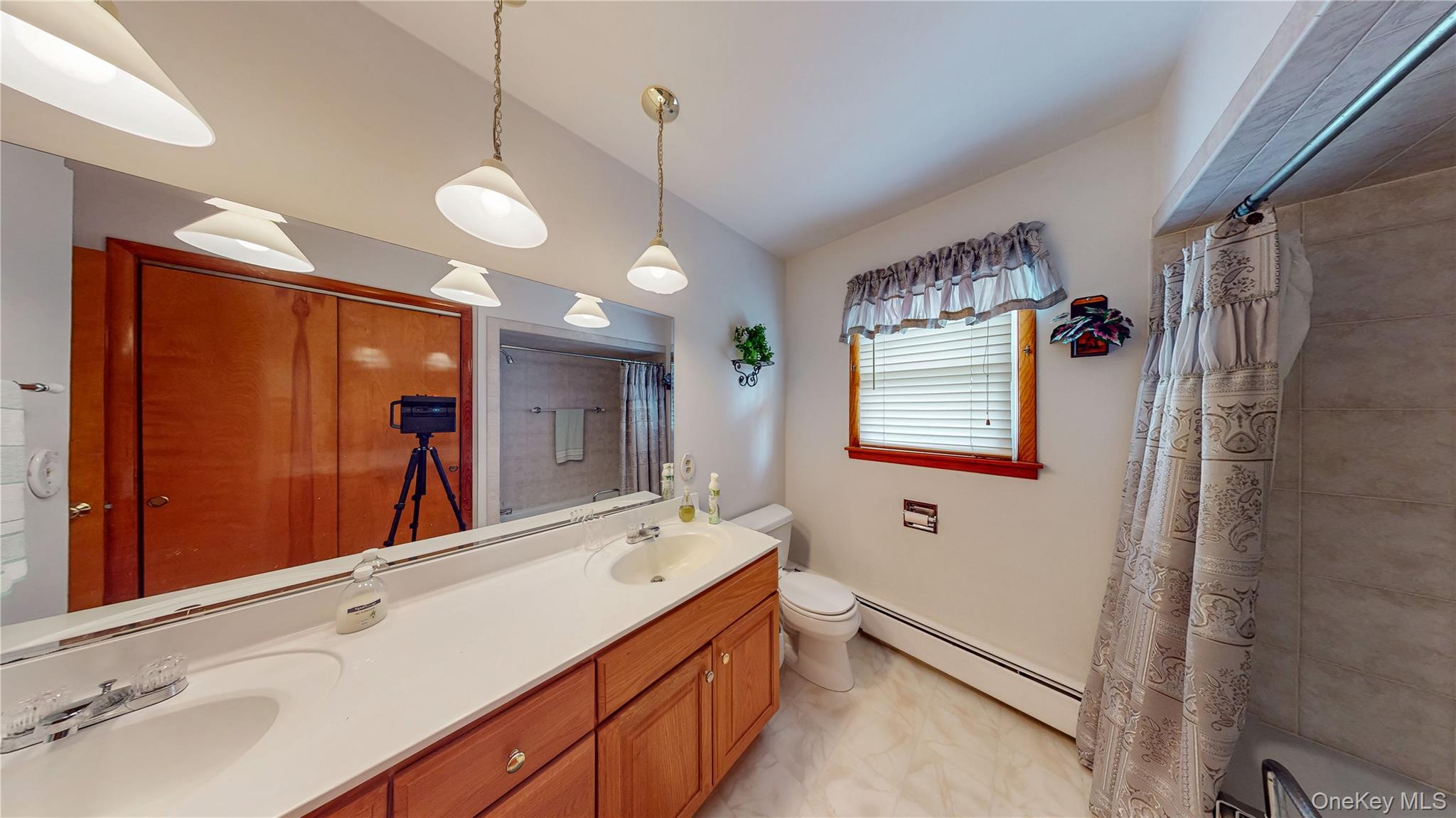 31 Rose Street Florida, NY 10921 - Photo 19 of 31 a bathroom with a double vanity sink a mirror and a shower
