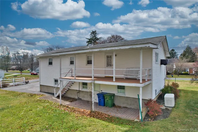 a view of a house with a backyard