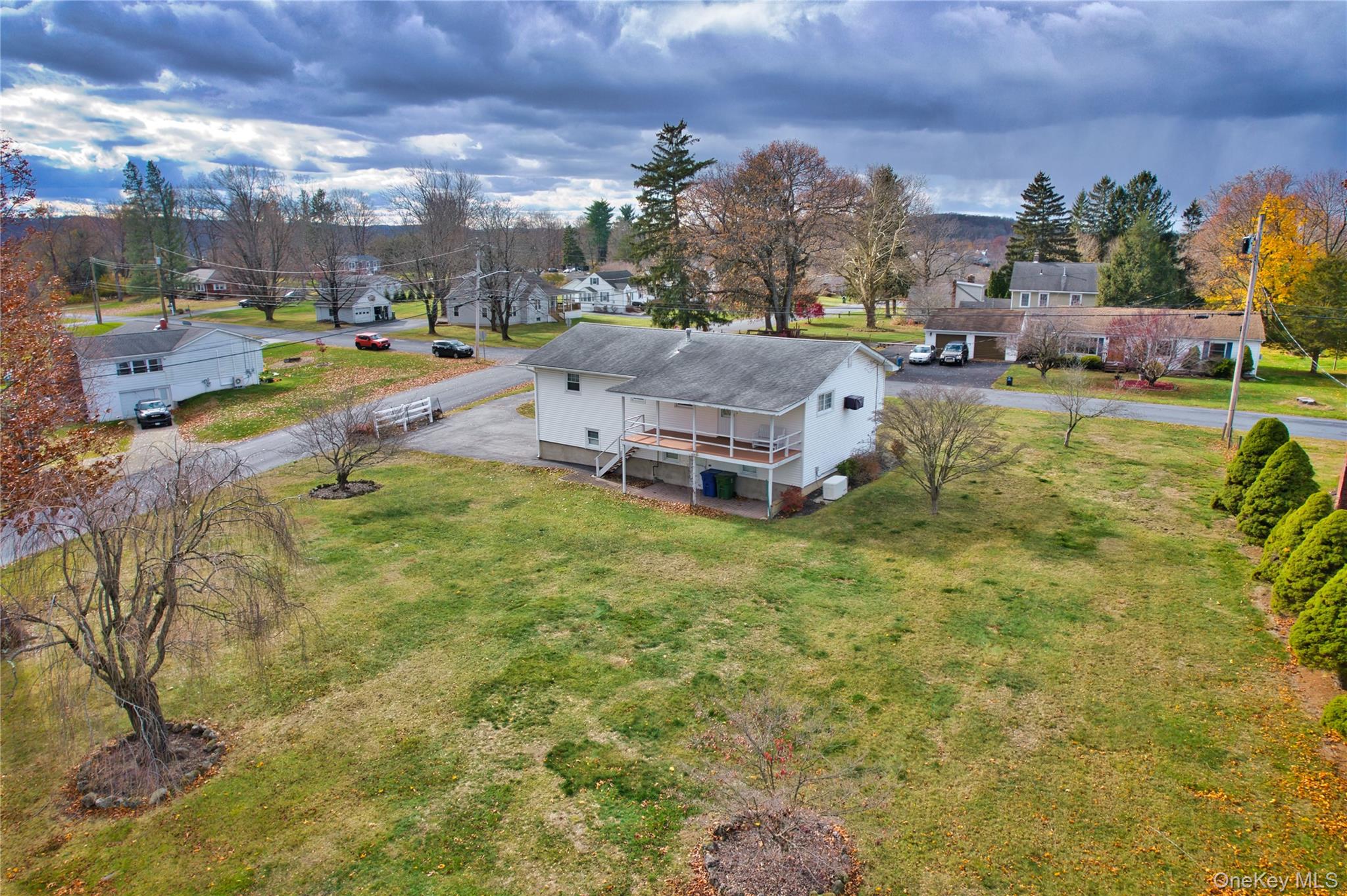 31 Rose Street Florida, NY 10921 - Photo 3 of 31 a aerial view of a house with swimming pool and large trees