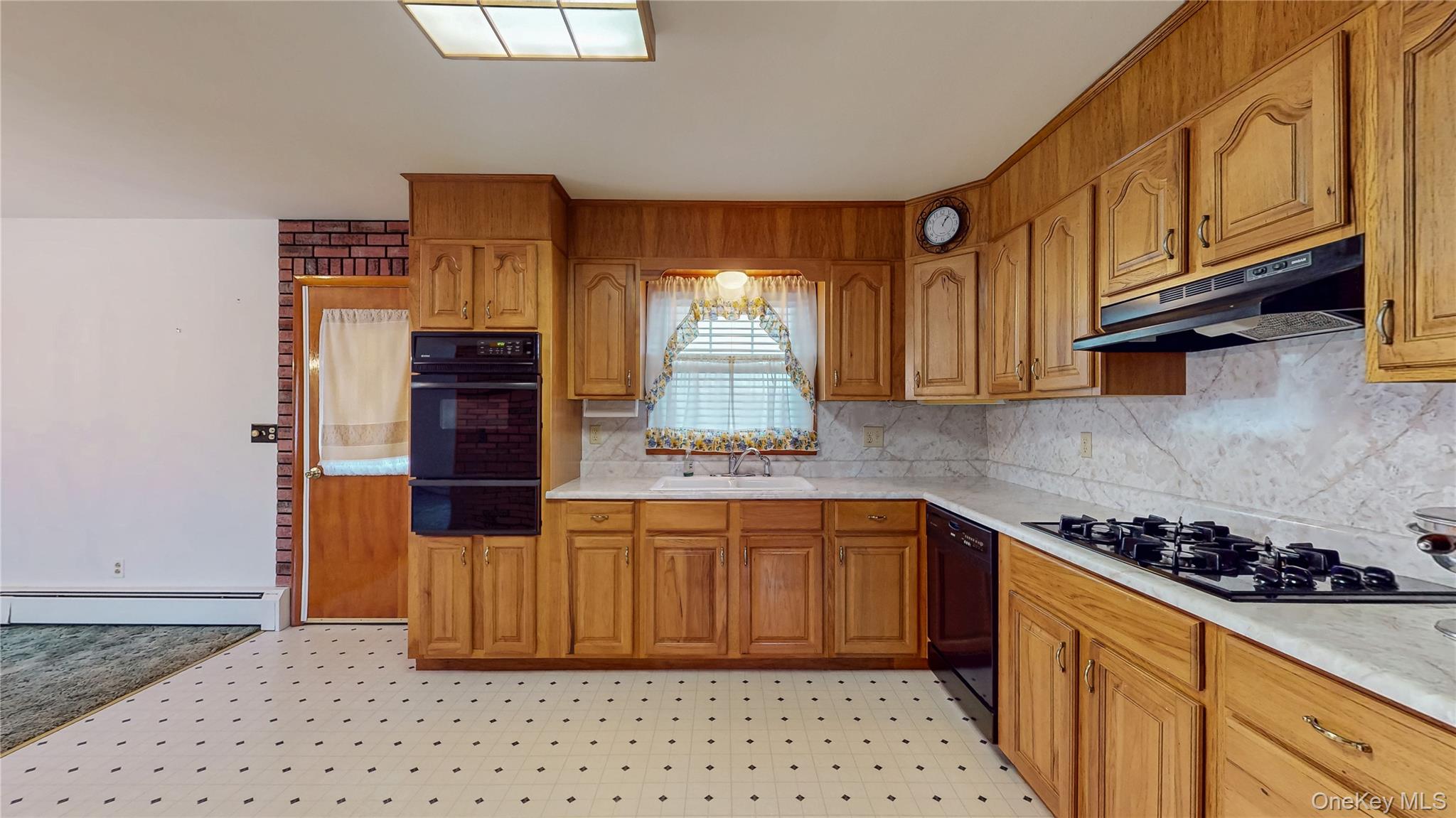 31 Rose Street Florida, NY 10921 - Photo 6 of 31 a kitchen with stainless steel appliances a stove a refrigerator and cabinets