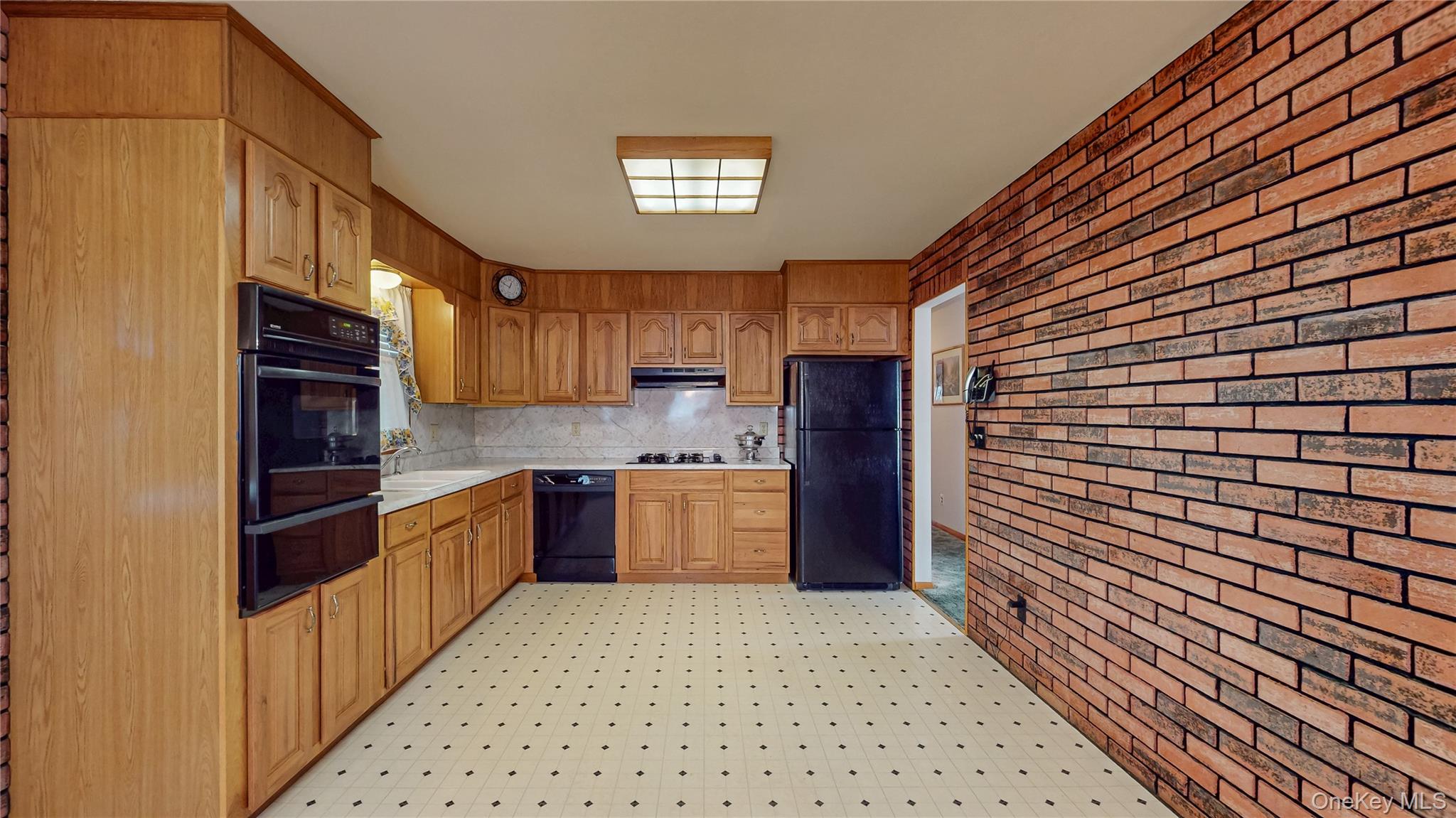 31 Rose Street Florida, NY 10921 - Photo 7 of 31 a kitchen with stainless steel appliances granite countertop a refrigerator and a stove top oven