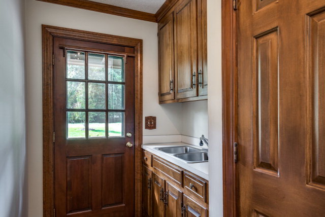 3900 Gloucester Road Rocky Mount, NC 27803 - Photo 13 of 33 What a convenient laundry area as you enter at the side of the house. It includes a sink and hook ups for a washer and dryer!