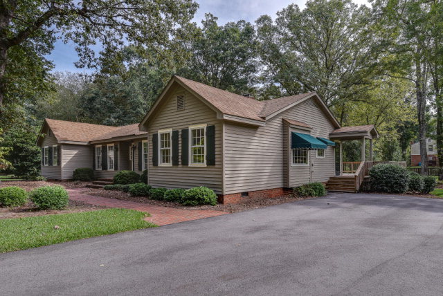 3900 Gloucester Road Rocky Mount, NC 27803 - Photo 2 of 33 Located on a corner lot, the this nice home has a beautifully landscaped yard and semi-circle asphalt driveway. So convenient to the side entry and the front walkway!