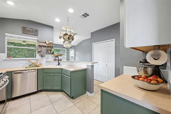 a kitchen with sink and window