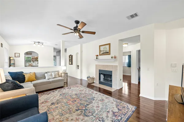 a living room with furniture and a fireplace
