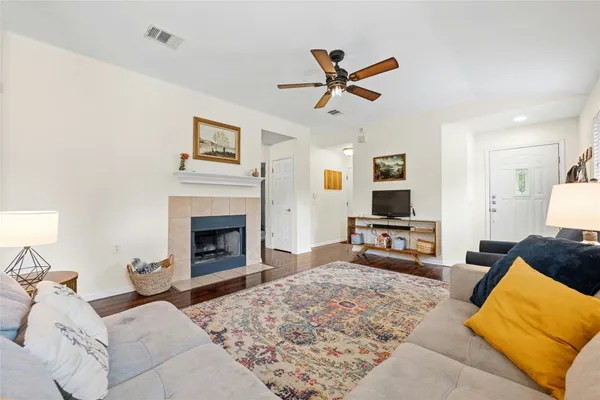 a living room with furniture and a fireplace