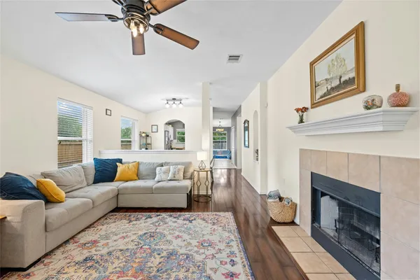 a living room with furniture and a fireplace