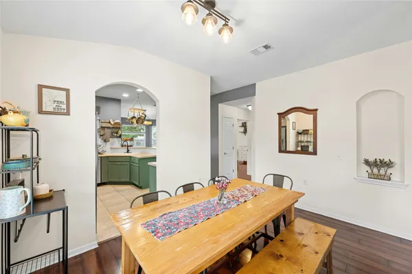 a living room with dining table