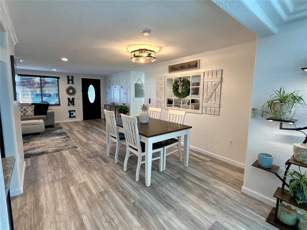 5129 Idlewild Street New Port Richey, FL 34653 - Photo 16 of 28 a view of a livingroom with furniture window and wooden floor