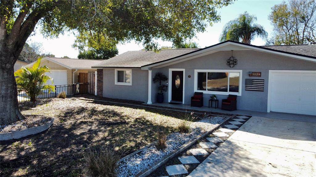5129 Idlewild Street New Port Richey, FL 34653 - Photo 24 of 28 a house view with a outdoor space