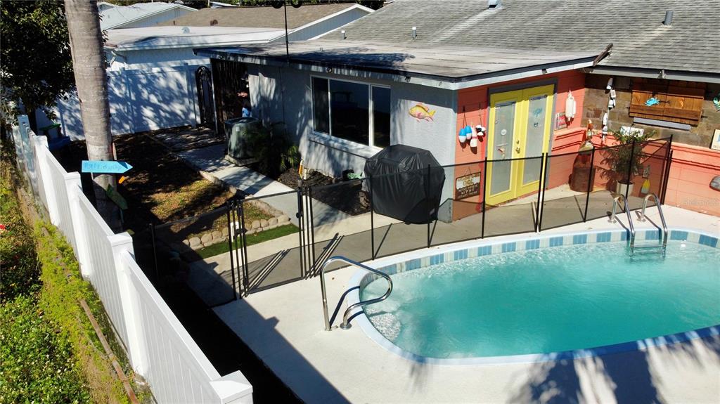 5129 Idlewild Street New Port Richey, FL 34653 - Photo 5 of 28 a balcony with table and chairs