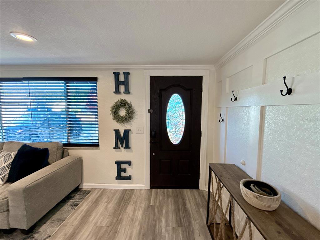 5129 Idlewild Street New Port Richey, FL 34653 - Photo 6 of 28 a living room with furniture and a window