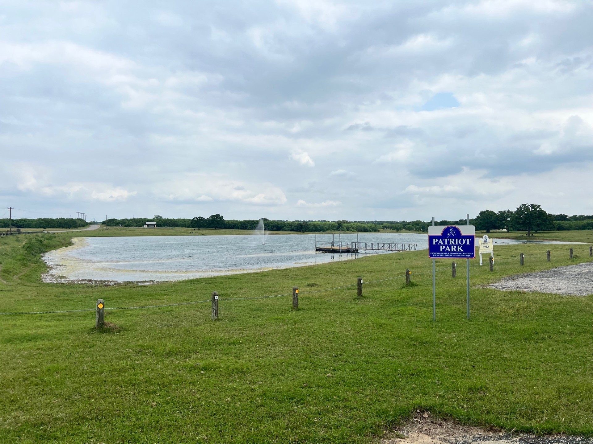 Lot 17 Settlement Way Luling, TX 78648 - Photo 2 of 14 Experience waterside tranquility with an expansive, well-maintained lawn offering serene views of the lake.